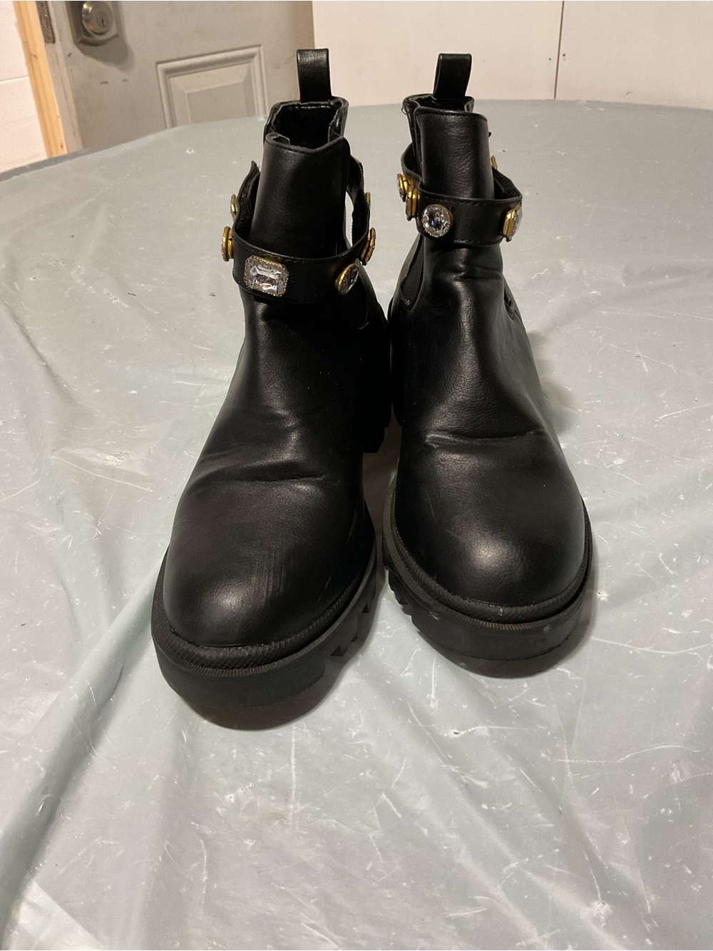 Black Leather Ankle Boots with Gold Accent